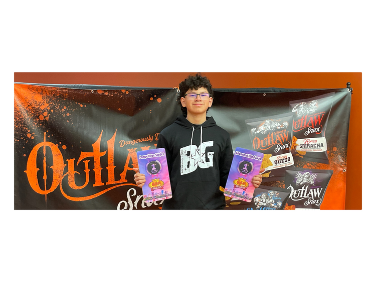 Phatboy holding 2 1st place plaques from a cornhole tournament in Little Rock